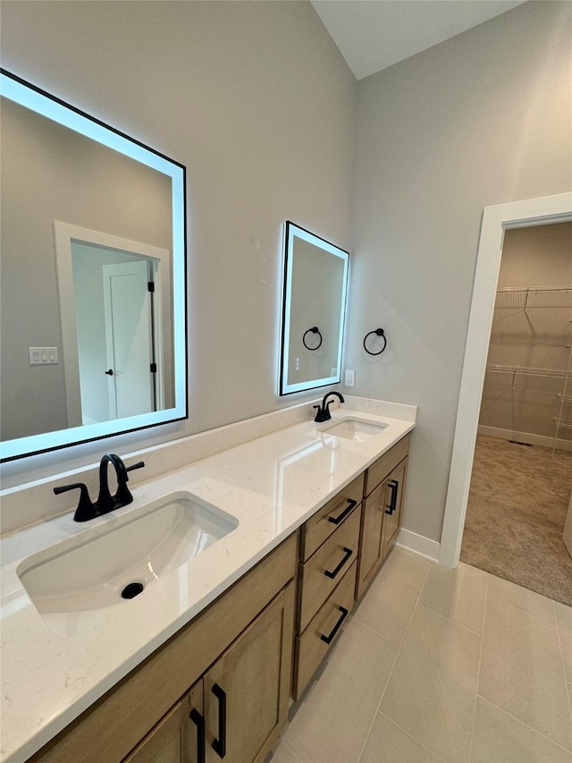 203 Hudson Ave, Van Meter, IA 50261 - full bathroom featuring double vanity, tile patterned floors, and a spacious closet