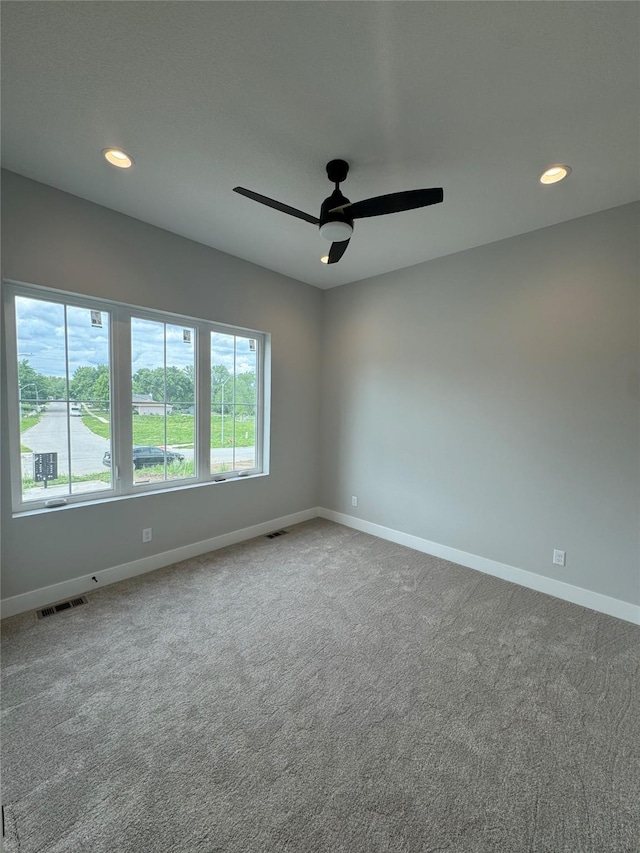203 Hudson Ave, Van Meter, IA 50261 - carpeted empty room with baseboards, a ceiling fan, and recessed lighting