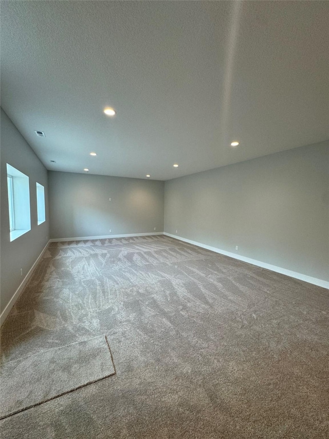 203 Hudson Ave, Van Meter, IA 50261 - carpeted spare room featuring recessed lighting, baseboards, and a textured ceiling