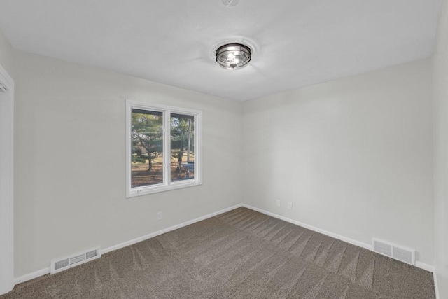 spare room featuring carpet floors