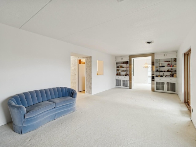 sitting room featuring carpet floors