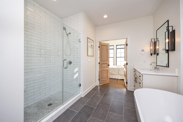 bathroom with tile patterned flooring, vanity, and separate shower and tub