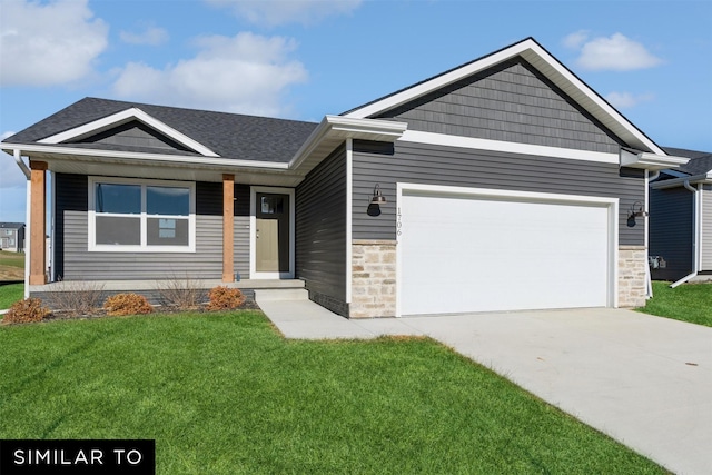 view of front facade with a front yard and a garage