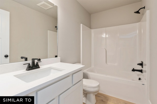 full bathroom with shower / bath combination, vanity, toilet, and wood-type flooring