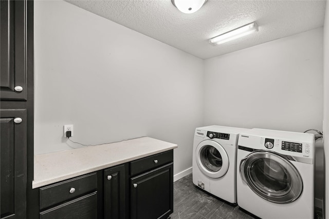 laundry room featuring cabinets, dark hardwood / wood-style floors, washer and dryer, and a textured ceiling