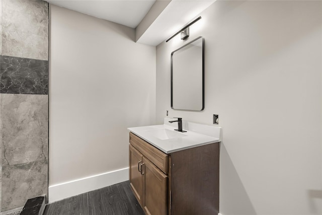 bathroom with vanity and hardwood / wood-style floors