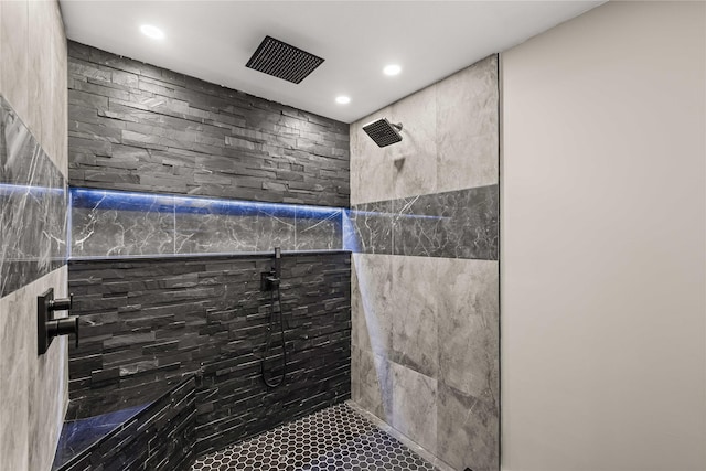 bathroom with tiled shower