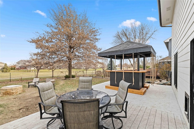 wooden terrace featuring a gazebo