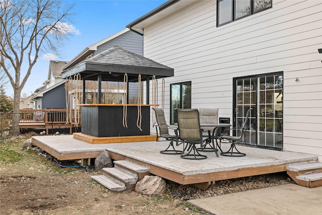 wooden terrace featuring a gazebo