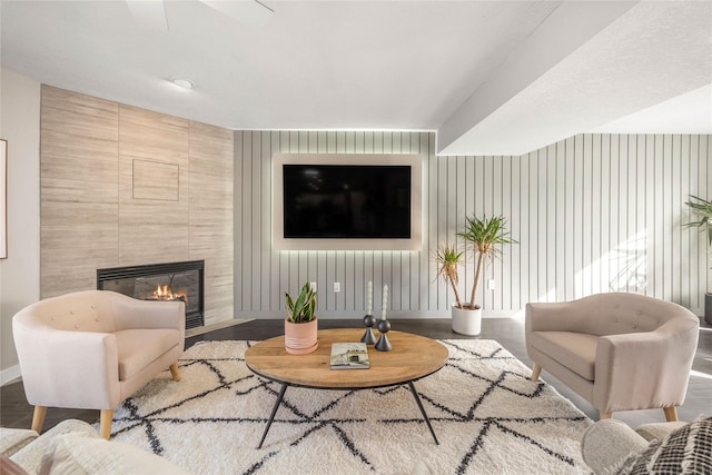 living room featuring hardwood / wood-style flooring and a fireplace