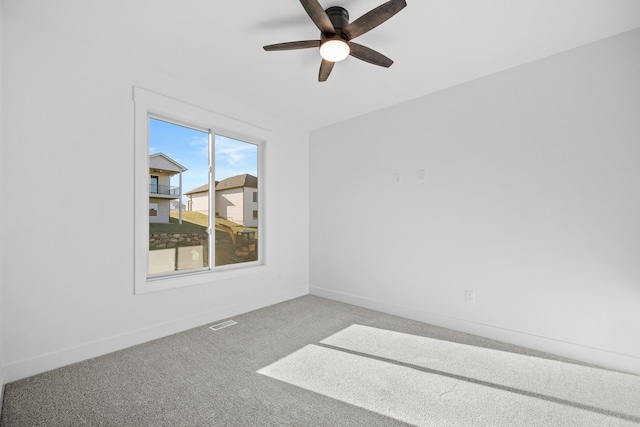 carpeted empty room with ceiling fan