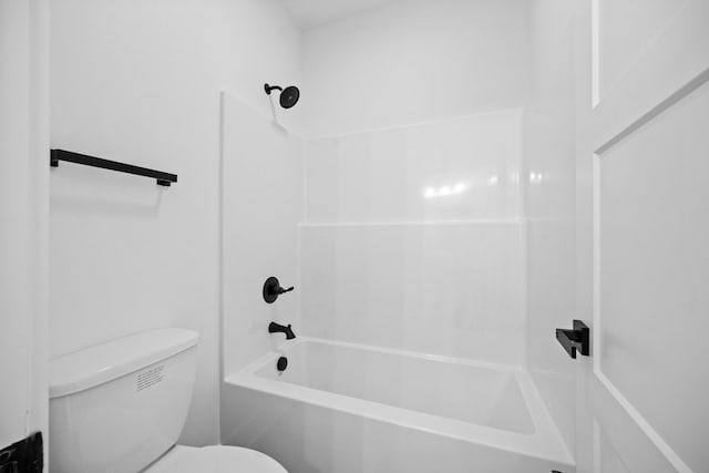 bathroom featuring toilet and shower / tub combination