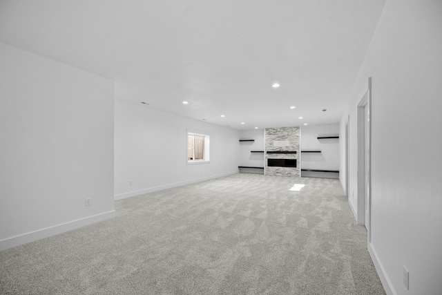 unfurnished living room featuring light carpet