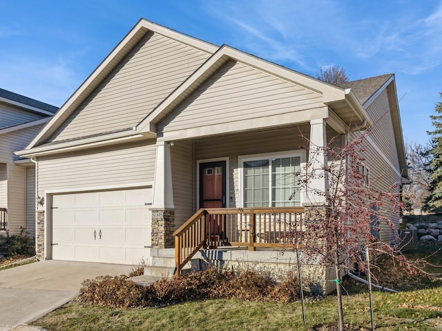 view of front of home with covered porch and a garage