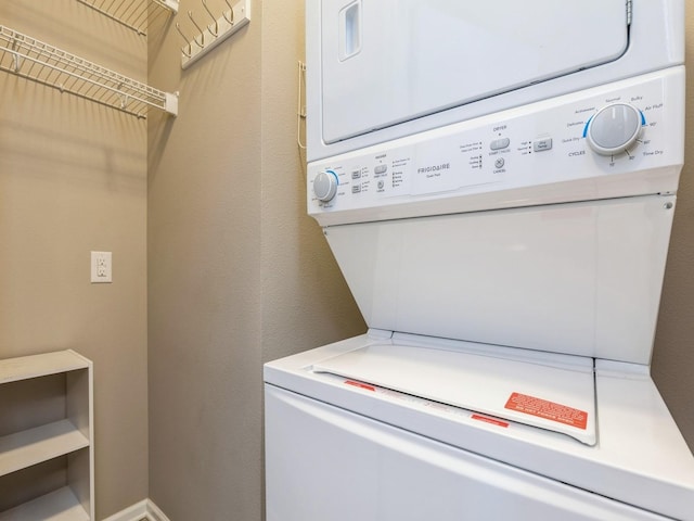 laundry room with stacked washer and dryer