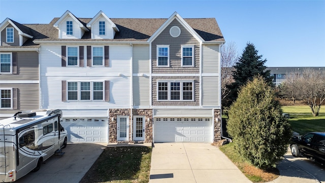 townhome / multi-family property featuring a garage