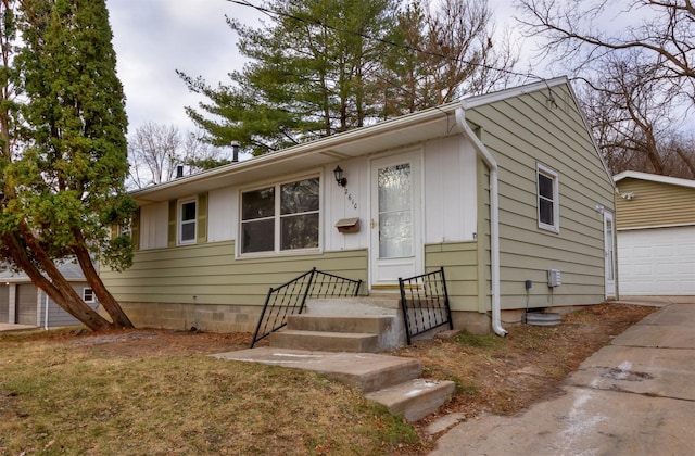 single story home with an outbuilding