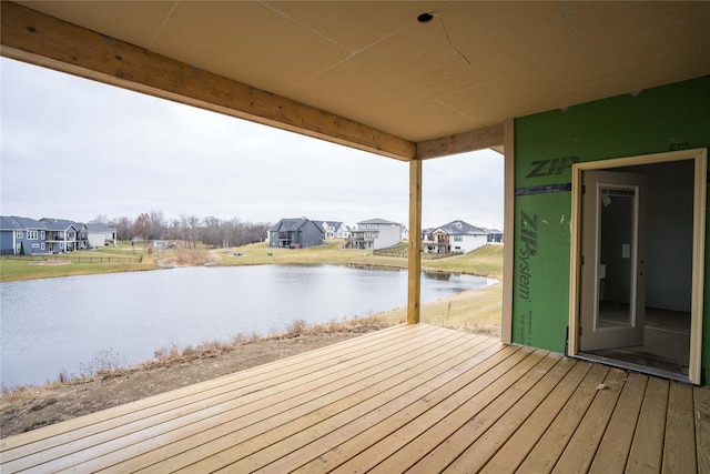 wooden deck featuring a water view