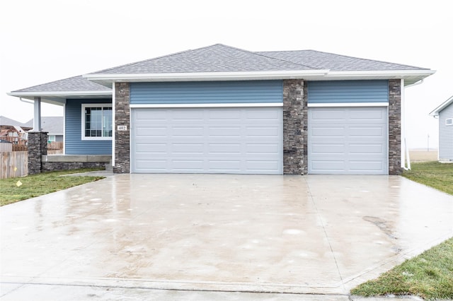 prairie-style house featuring a garage