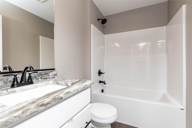 full bathroom featuring tub / shower combination, a textured ceiling, toilet, vanity, and hardwood / wood-style flooring