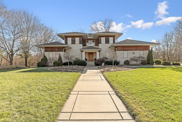 prairie-style home featuring a front yard