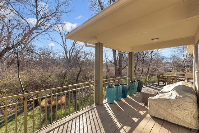 wooden deck featuring outdoor dining space