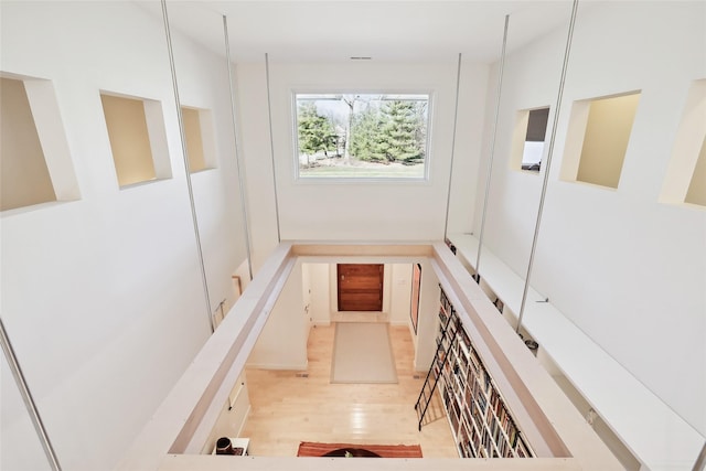 hallway featuring light wood finished floors