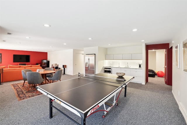 playroom featuring visible vents, a sink, light colored carpet, and recessed lighting