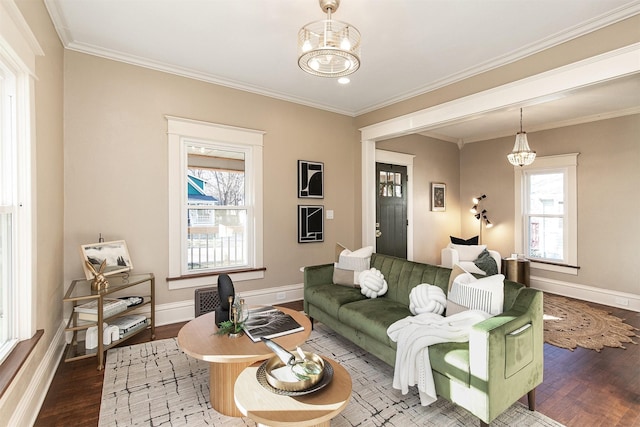 living room featuring hardwood / wood-style flooring, plenty of natural light, and a notable chandelier