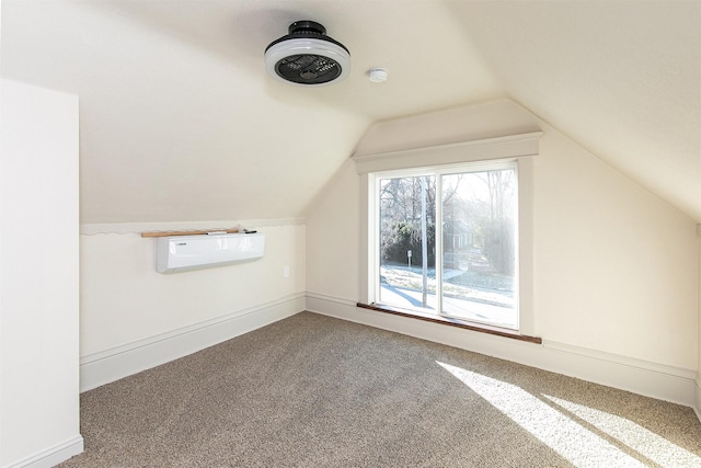 bonus room with a wall mounted air conditioner, carpet floors, and vaulted ceiling