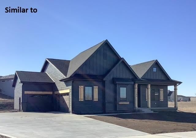 view of front of house with a garage and a porch