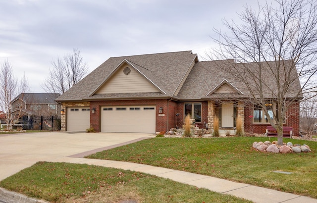 view of front facade with a garage and a front yard