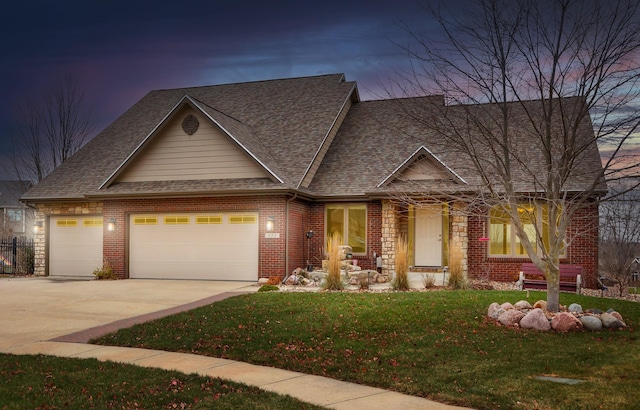 craftsman-style house with a lawn and a garage