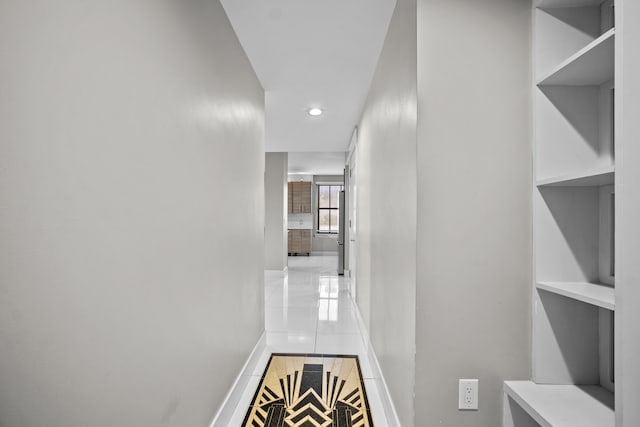 corridor with light tile patterned floors