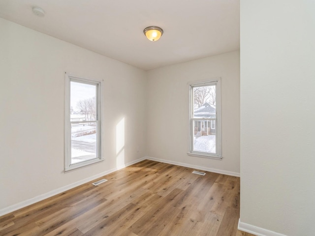 empty room with light wood-type flooring