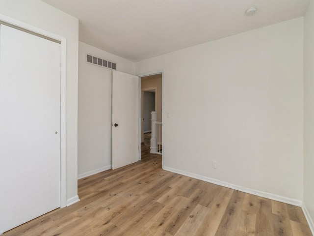 unfurnished bedroom with light hardwood / wood-style flooring