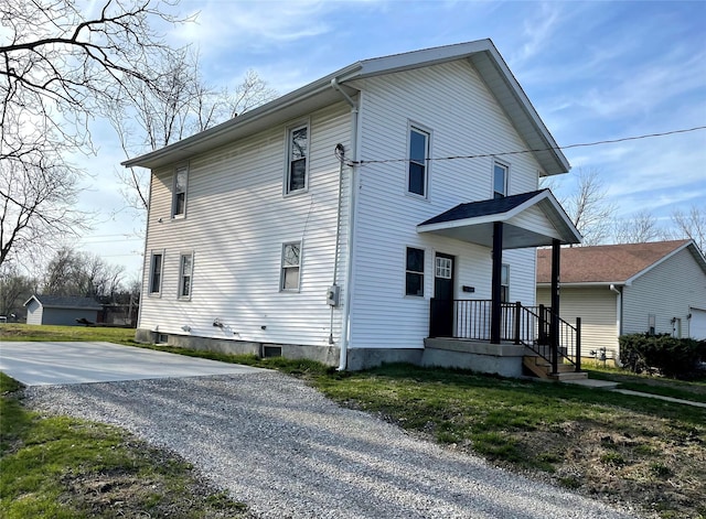 view of property exterior featuring gravel driveway
