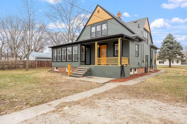 view of front of home featuring a porch and a front yard