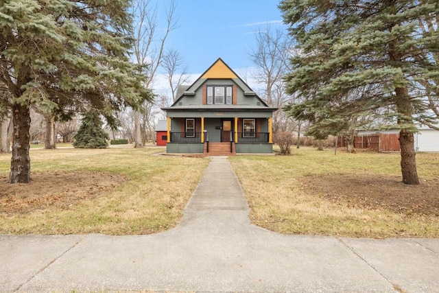 view of front of home with a front yard and covered porch