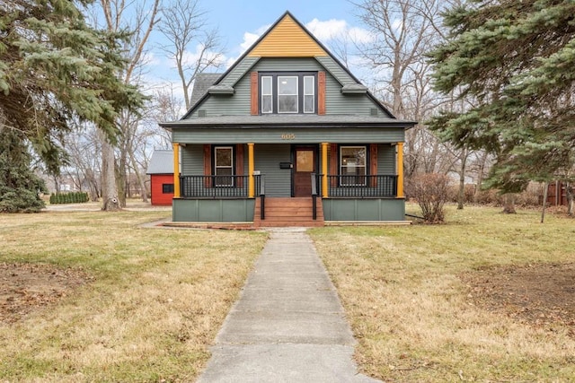 view of front of property with covered porch and a front lawn