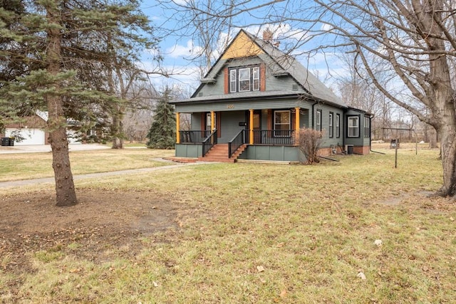 farmhouse-style home with a front yard and covered porch