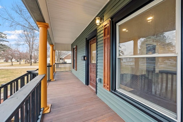 wooden deck featuring covered porch