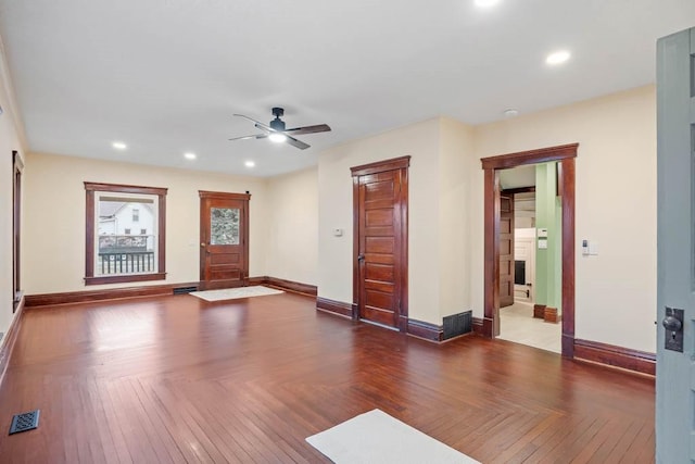 entryway with parquet floors and ceiling fan