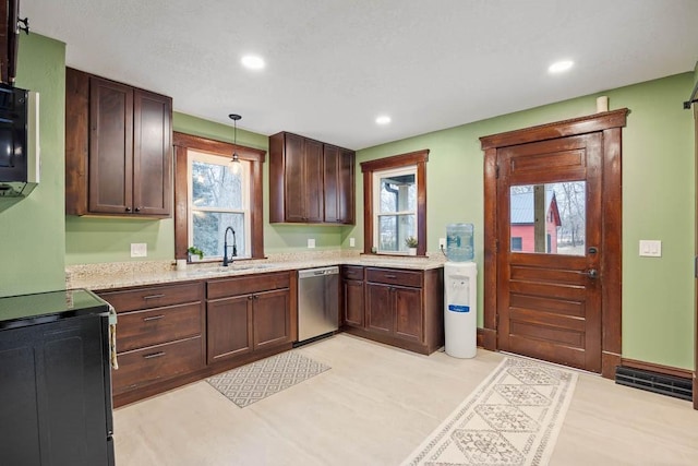 kitchen featuring decorative light fixtures, dishwasher, sink, light stone counters, and dark brown cabinets