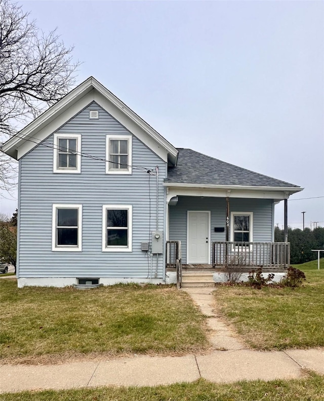 view of front of house with covered porch and a front yard