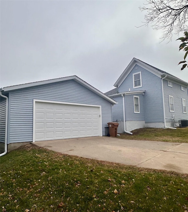 exterior space with central AC unit and a yard