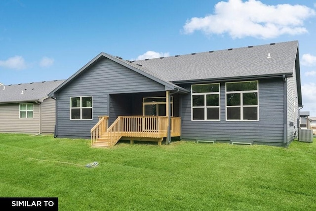 back of house with a lawn, a wooden deck, and central AC