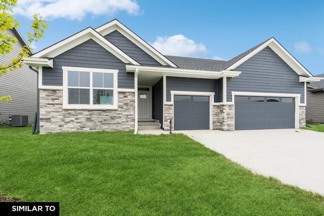 craftsman-style home featuring central AC and a front lawn