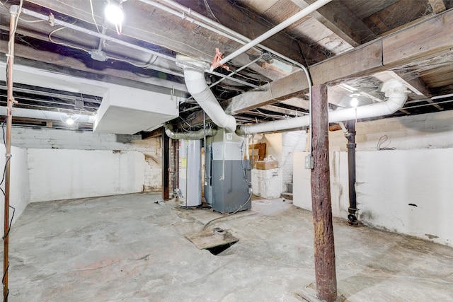 basement with heating unit and gas water heater