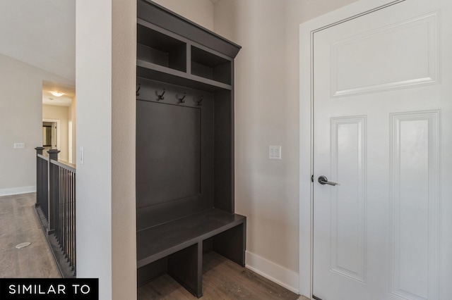 mudroom with dark wood-type flooring